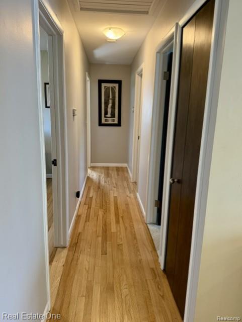 1115 Torpey Road Troy, MI 48083 - Photo 25 of 38 Corridor featuring light wood-style flooring and baseboards