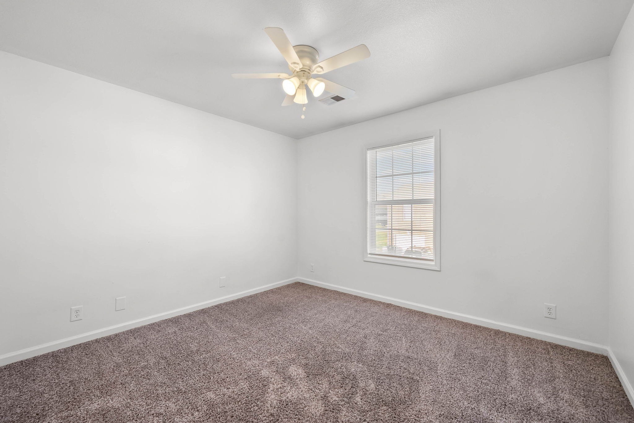 535 Lafayette Road, Unit F Clarksville, TN 37042 - Photo 18 of 26 an empty room with windows and chandelier fan