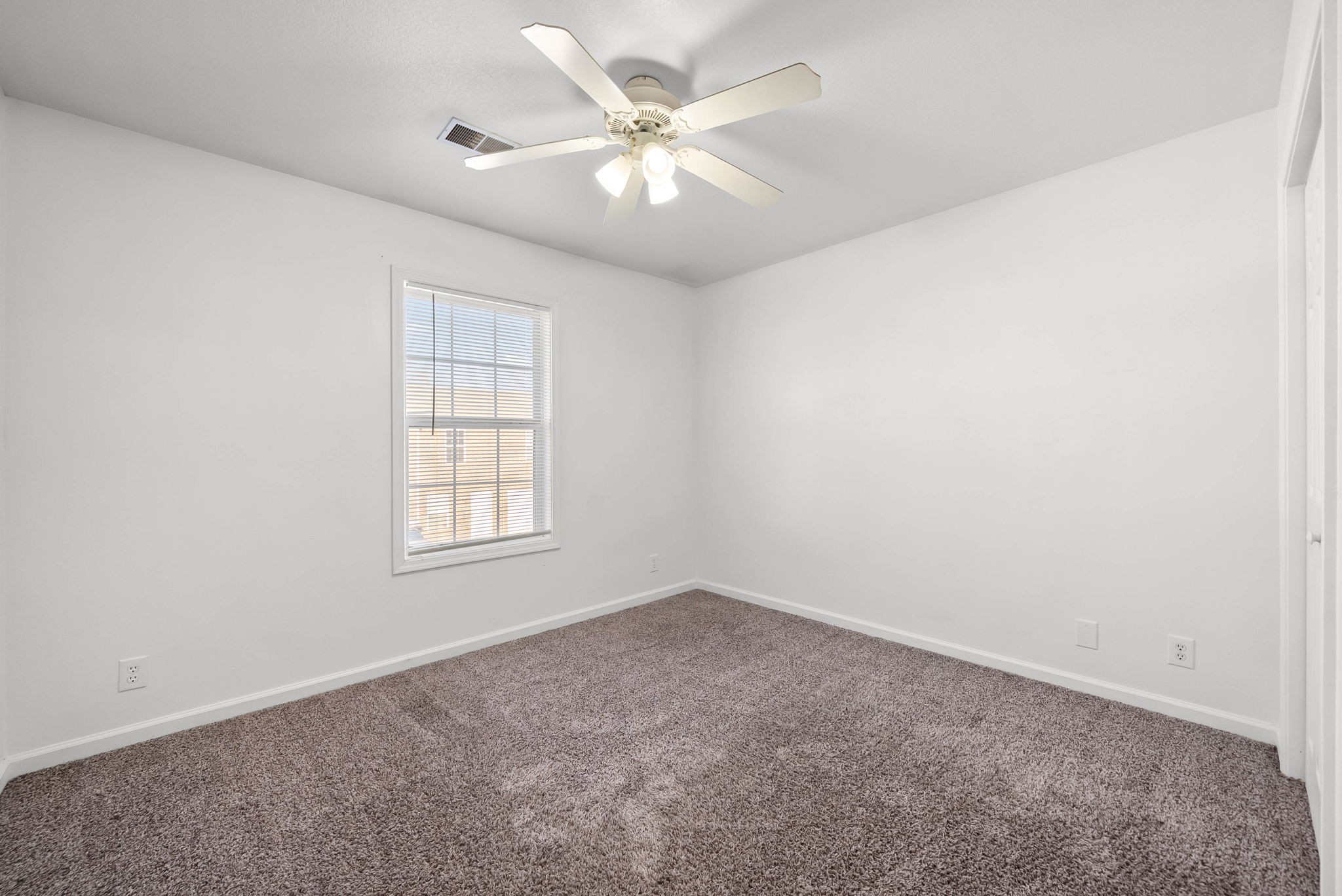 535 Lafayette Road, Unit F Clarksville, TN 37042 - Photo 20 of 26 an empty room with windows and chandelier fan