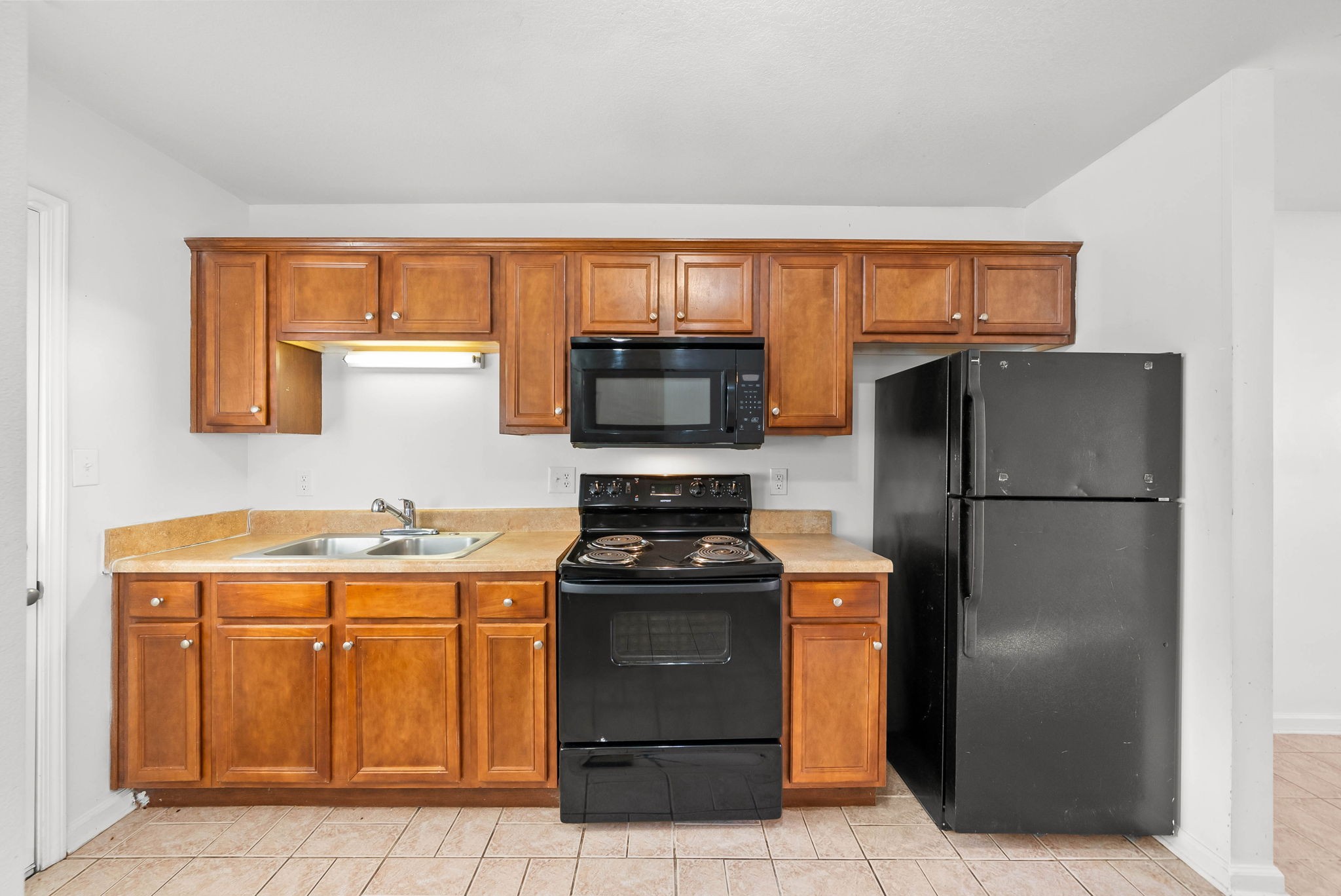 535 Lafayette Road, Unit F Clarksville, TN 37042 - Photo 8 of 26 a kitchen with a refrigerator and a stove