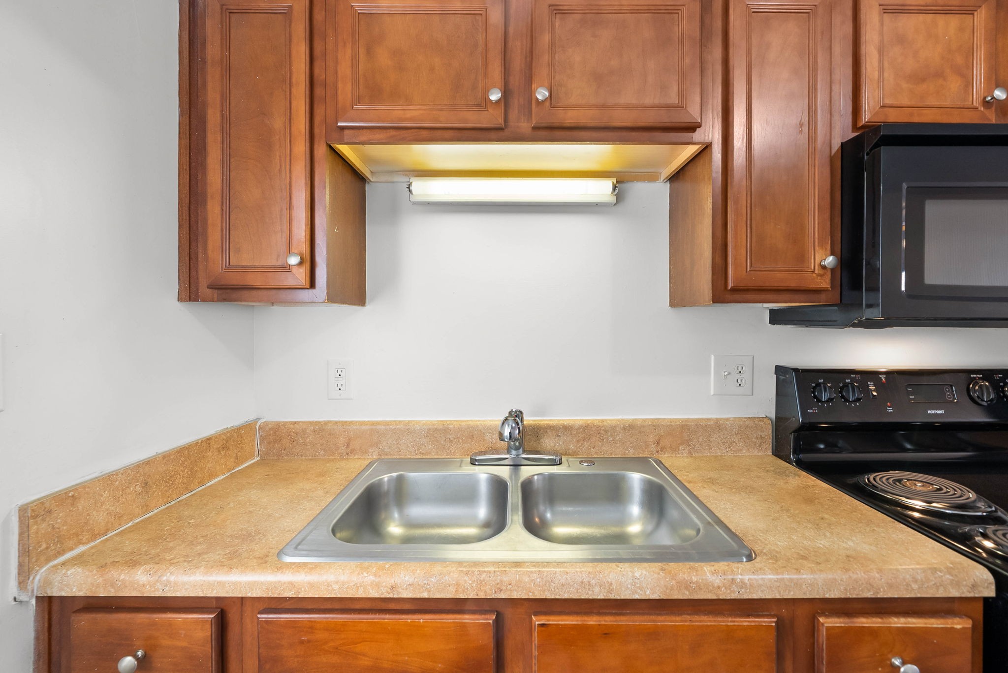 535 Lafayette Road, Unit F Clarksville, TN 37042 - Photo 9 of 26 a kitchen with a sink and a stove top oven
