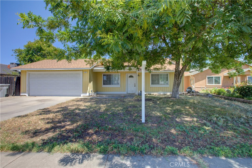 1581 Valencia Way Atwater, CA 95301 - Photo 1 of 1 a house that has a tree in front of it