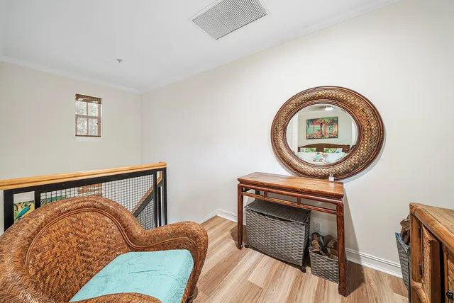 a bedroom with a bed and a chair