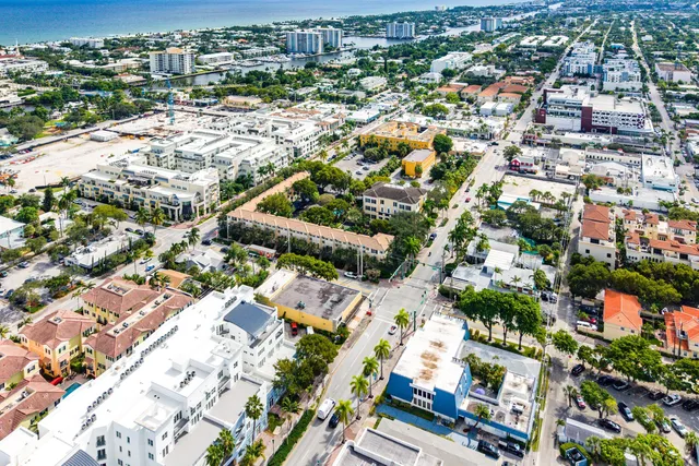 an aerial view of residential houses with city view