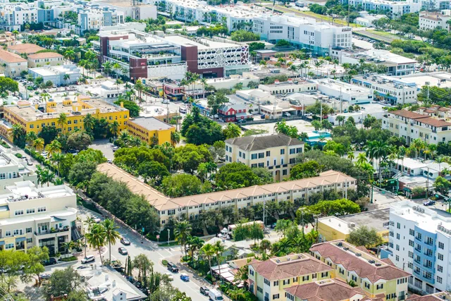 an aerial view of residential houses with outdoor space