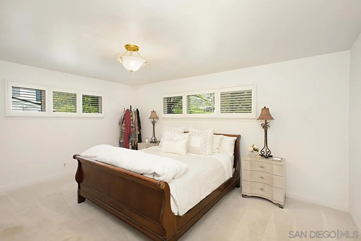 1465 Rodeo Drive La Jolla, CA 92037 - Photo 15 of 24 a bedroom with a bed and a window