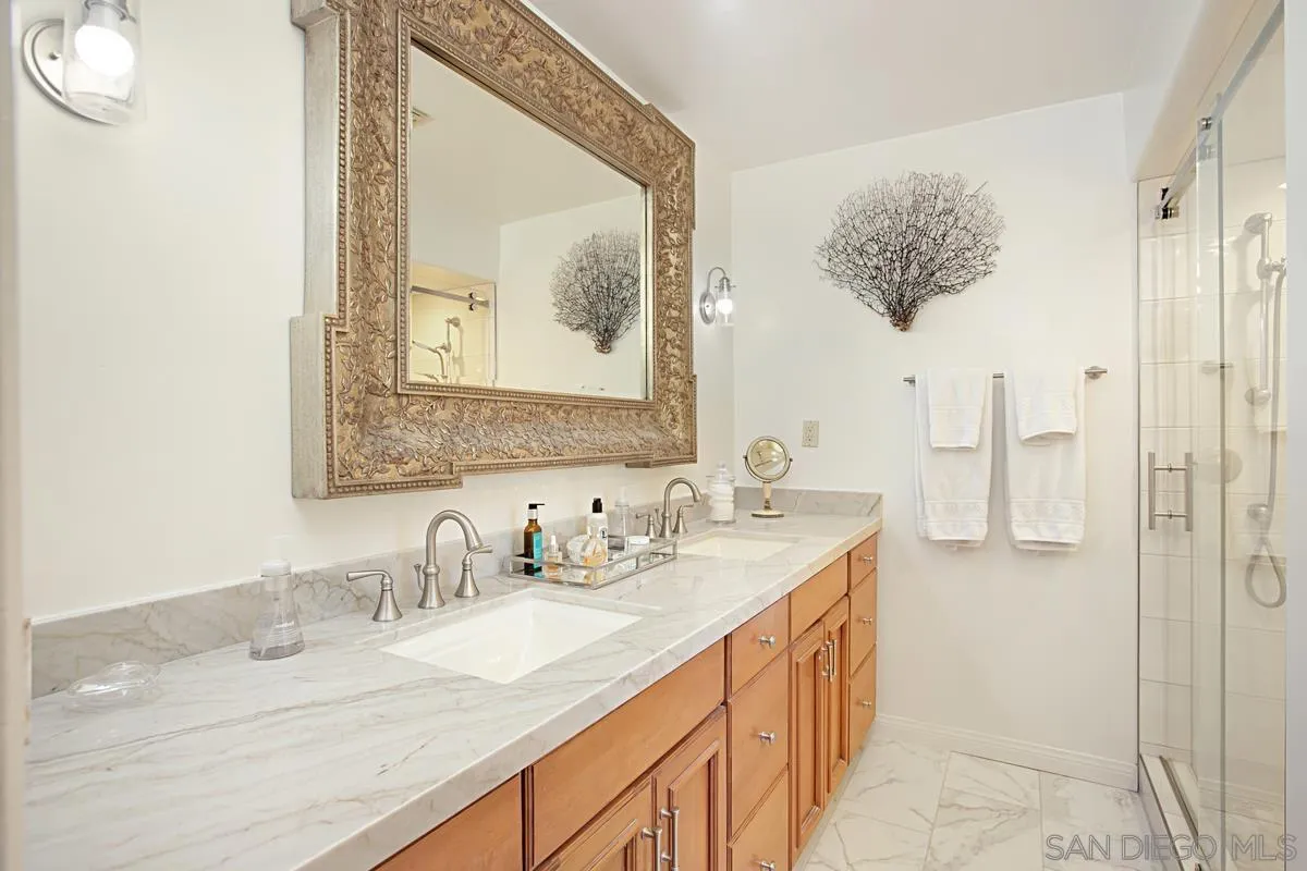 1465 Rodeo Drive La Jolla, CA 92037 - Photo 17 of 24 a bathroom with a double vanity sink mirror and