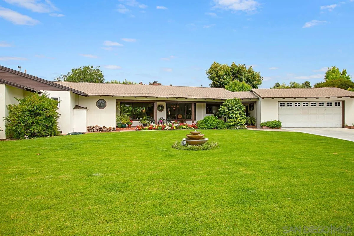 1465 Rodeo Drive La Jolla, CA 92037 - Photo 5 of 24 a view of an house with backyard and a tree
