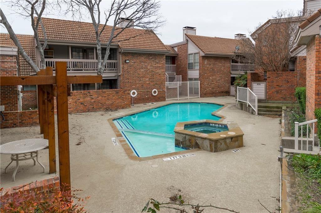 18240 Midway Road, Unit 302 Dallas, TX 75287 - Photo 30 of 33 a front view of house with outdoor seating yard and barbeque oven