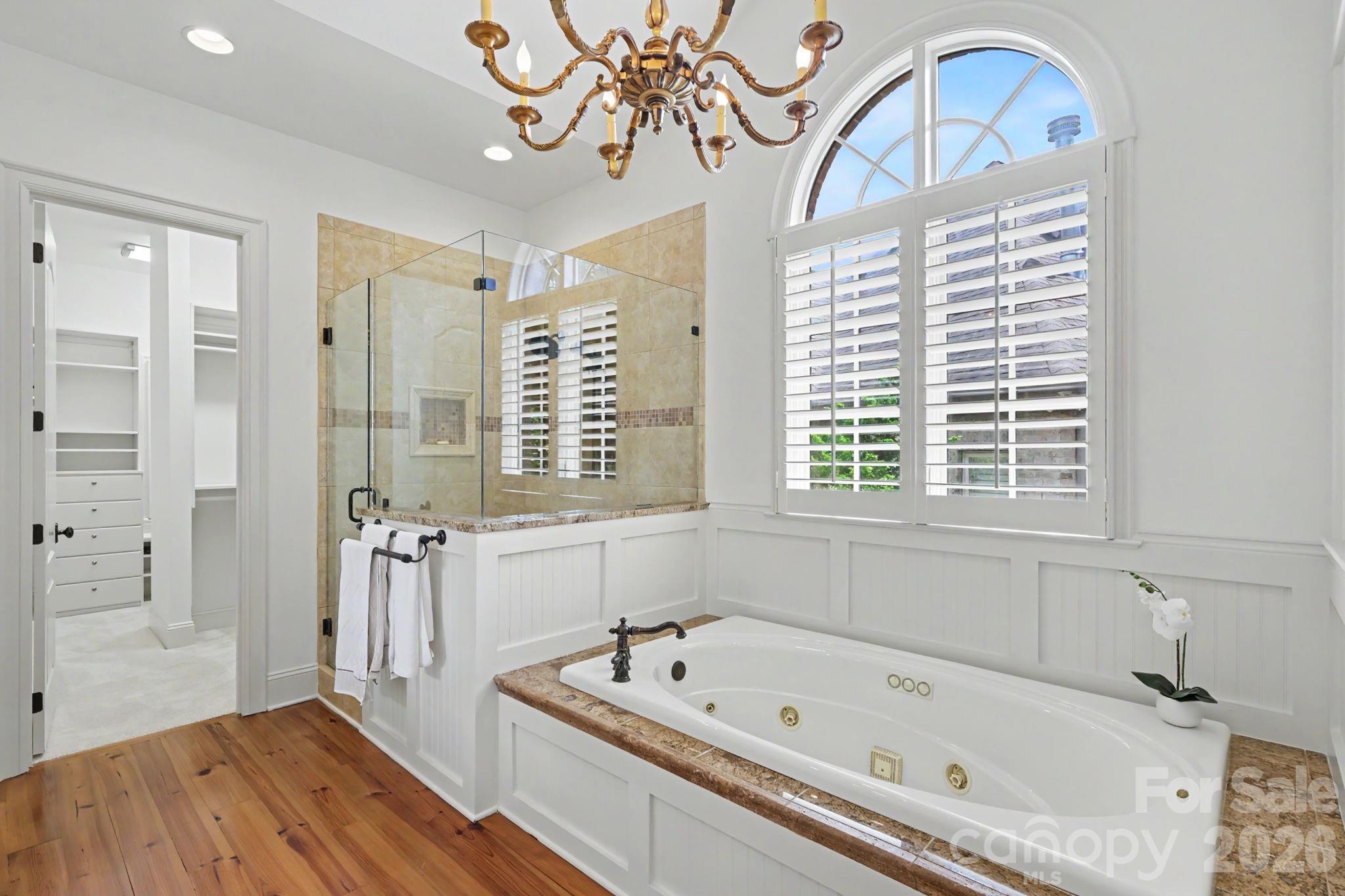 508 Hideaway Ridge Court Matthews, NC 28105 - Photo 13 of 47 a bathroom with a bathtub a sink and a window