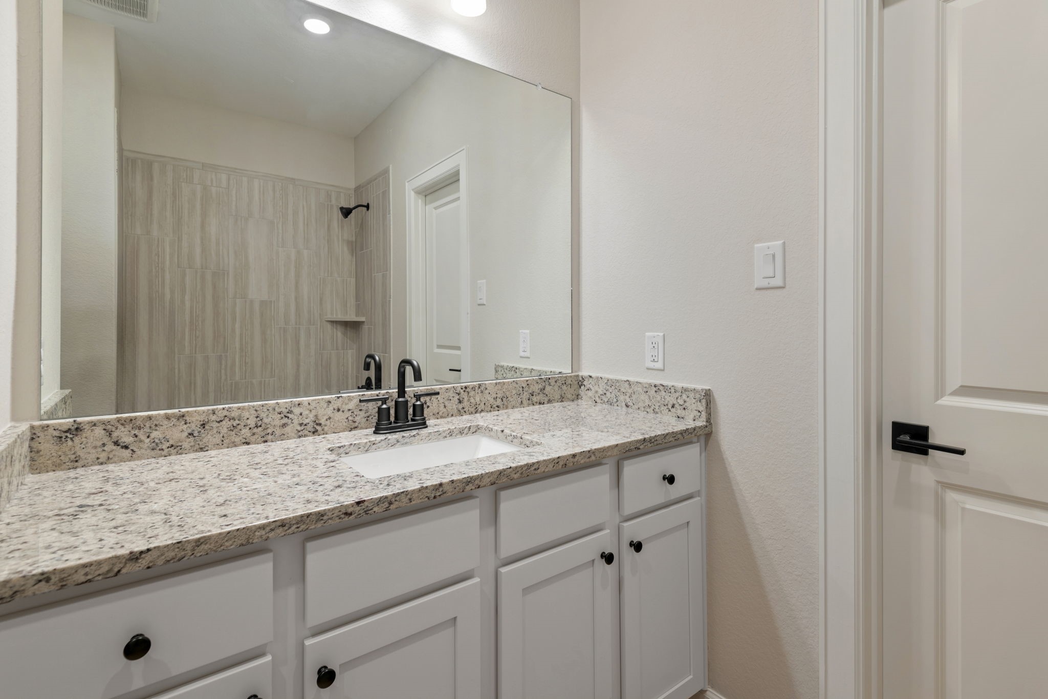 1115 Moonlight Trce Drive Beasley, TX 77417 - Photo 11 of 14 a bathroom with a granite countertop sink and a mirror
