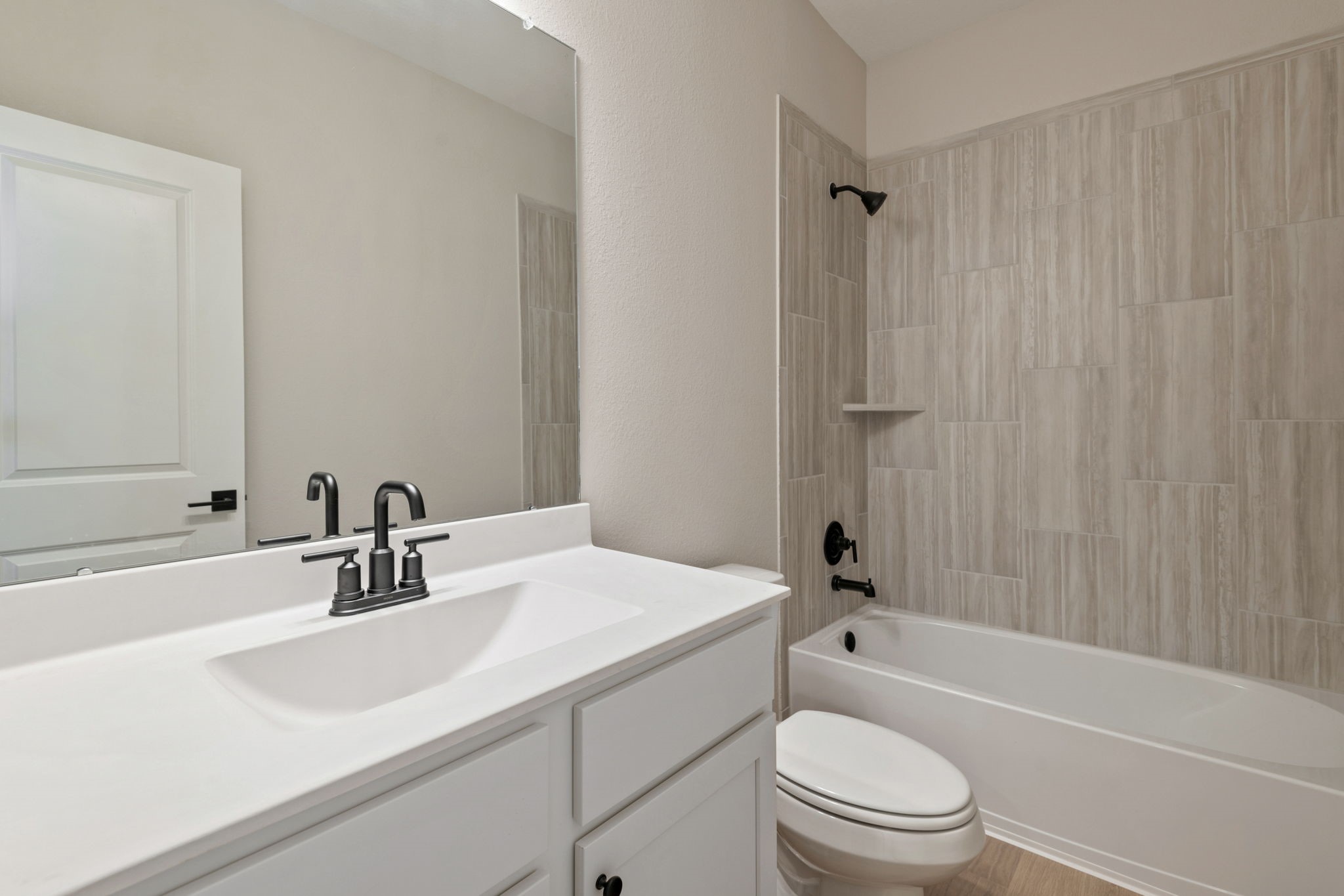 1115 Moonlight Trce Drive Beasley, TX 77417 - Photo 12 of 14 a bathroom with a sink a toilet and shower