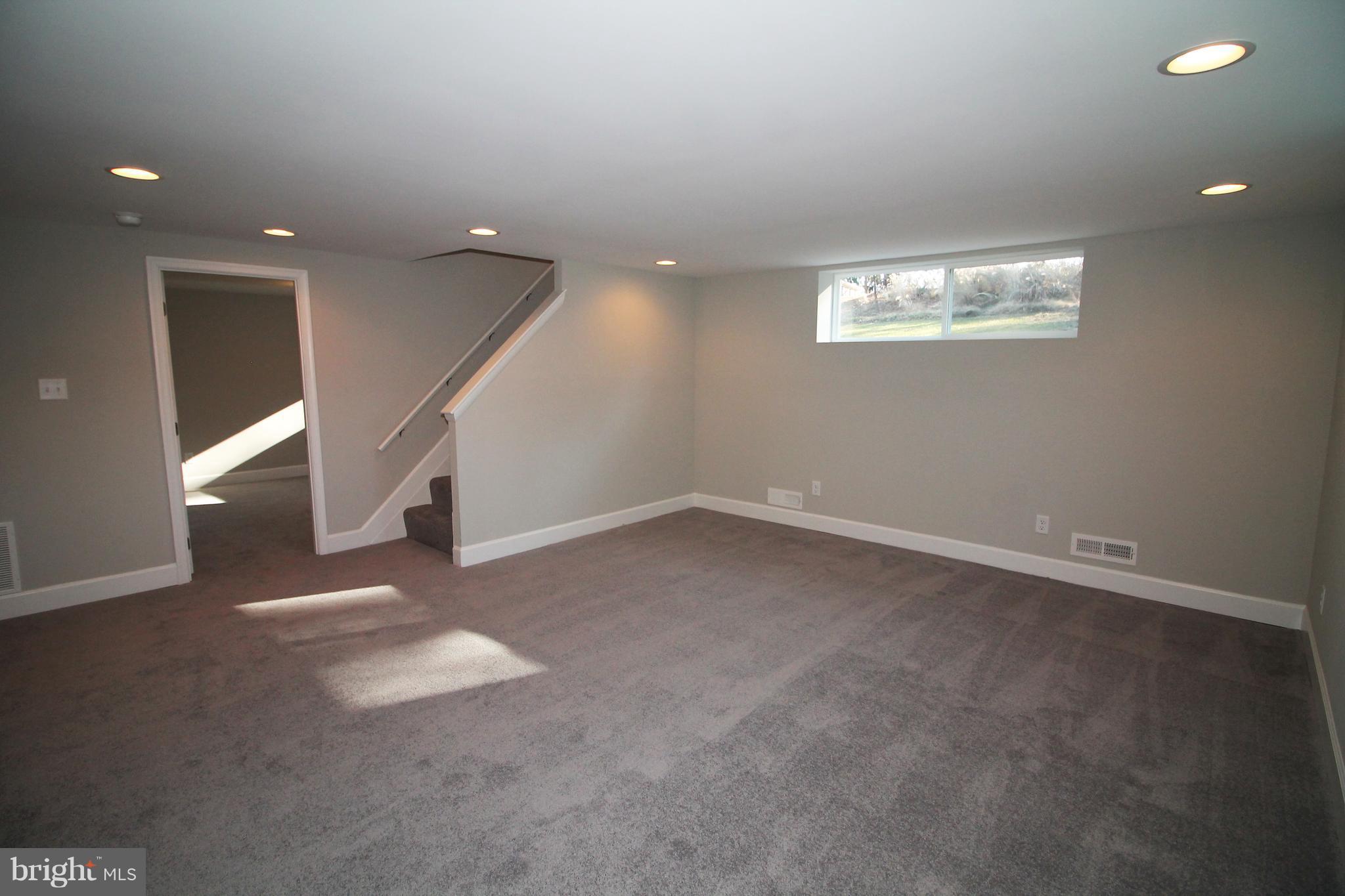 4525 Tapscott Road Baltimore, MD 21208 - Photo 22 of 29 an empty room with windows