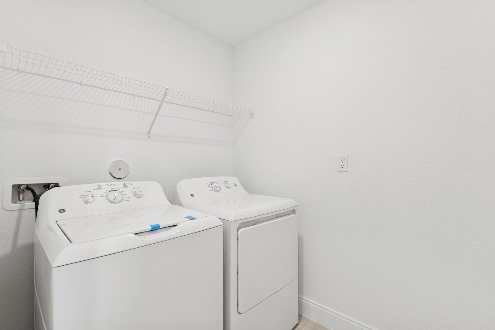 121 Southeast Birch Terrace, Unit 1157 Stuart, FL 34997 - Photo 15 of 34 a utility room with dryer and washer