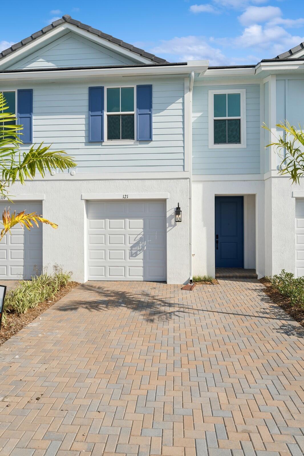 121 Southeast Birch Terrace, Unit 1157 Stuart, FL 34997 - Photo 2 of 34 front view of a house