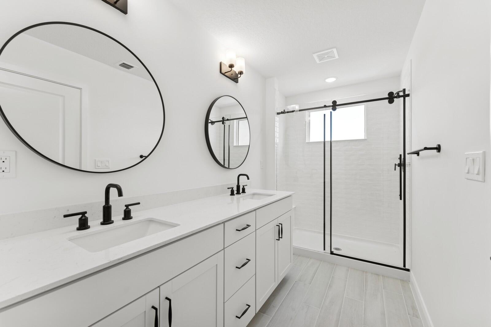 121 Southeast Birch Terrace, Unit 1157 Stuart, FL 34997 - Photo 27 of 34 a bathroom with a sink and a mirror
