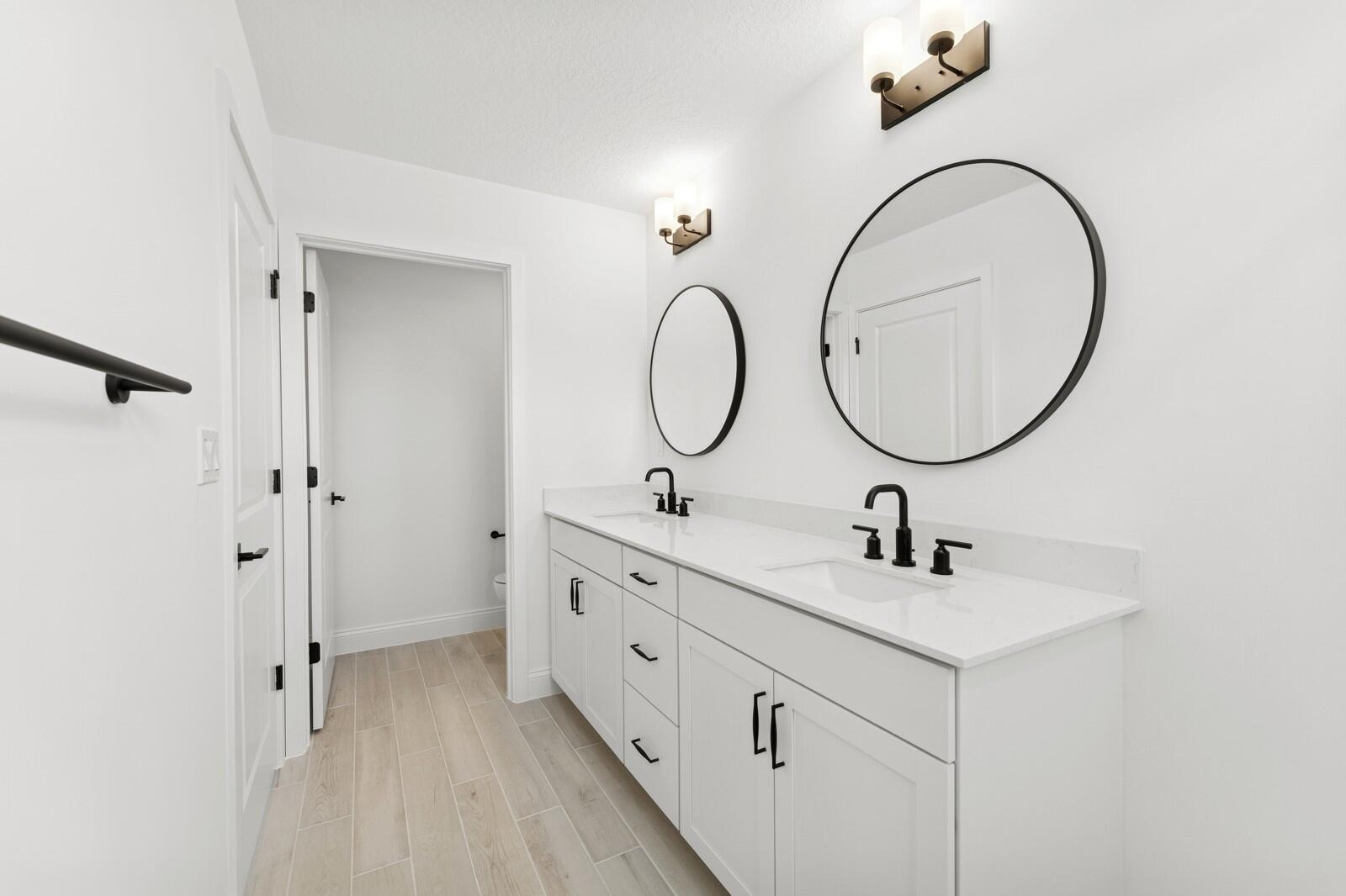121 Southeast Birch Terrace, Unit 1157 Stuart, FL 34997 - Photo 28 of 34 a bathroom with a sink and a mirror