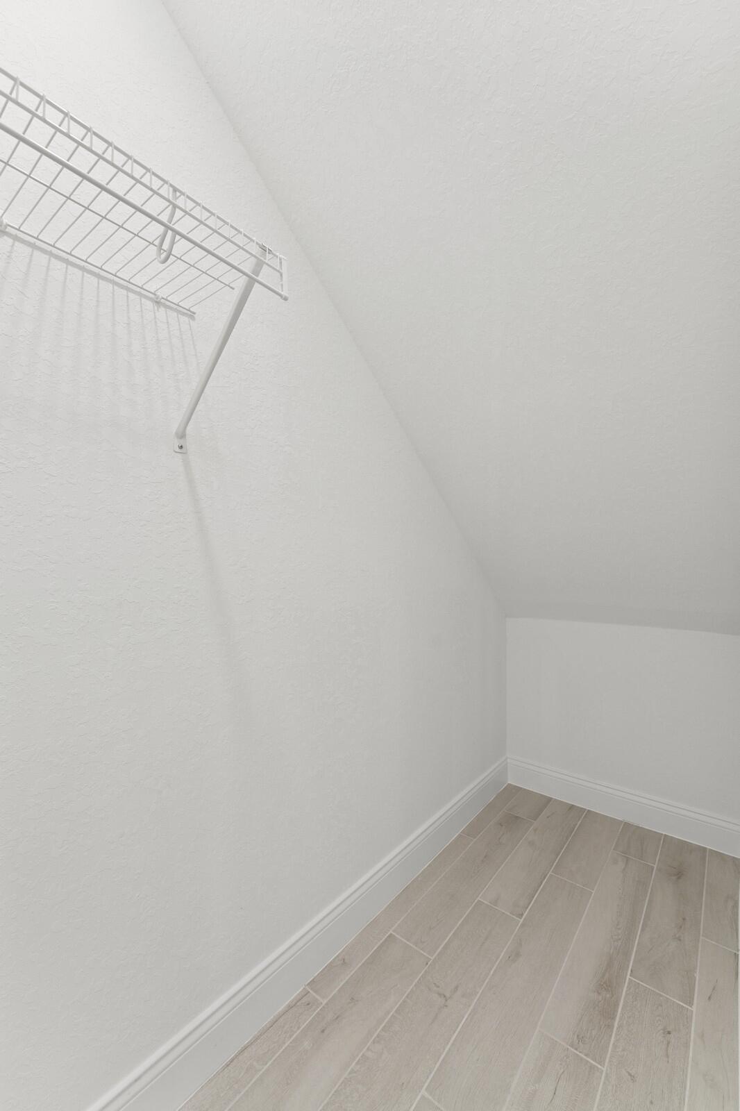 121 Southeast Birch Terrace, Unit 1157 Stuart, FL 34997 - Photo 5 of 34 a view of a room with white walls