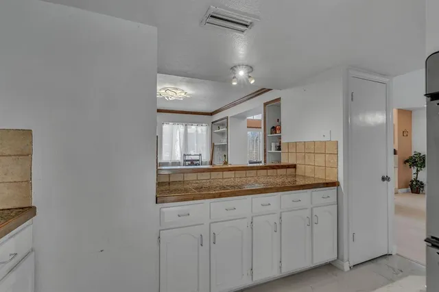 a bathroom with a granite countertop sink mirror and
