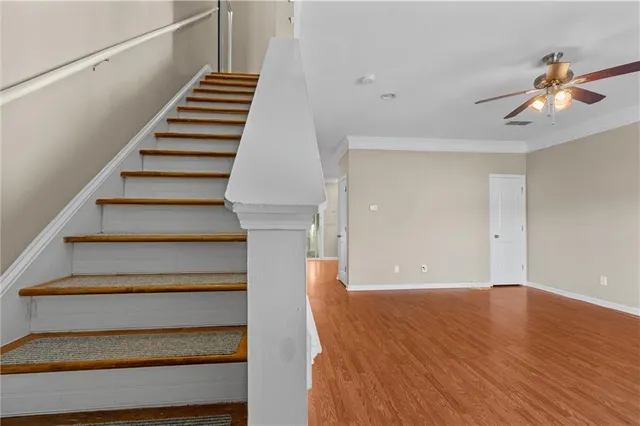 a view of entryway and hall with wooden floor