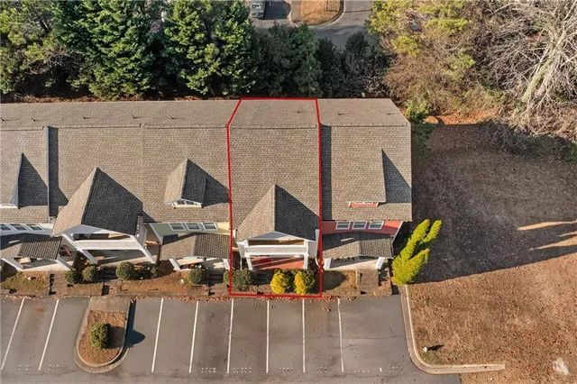 an aerial view of a house with outdoor space