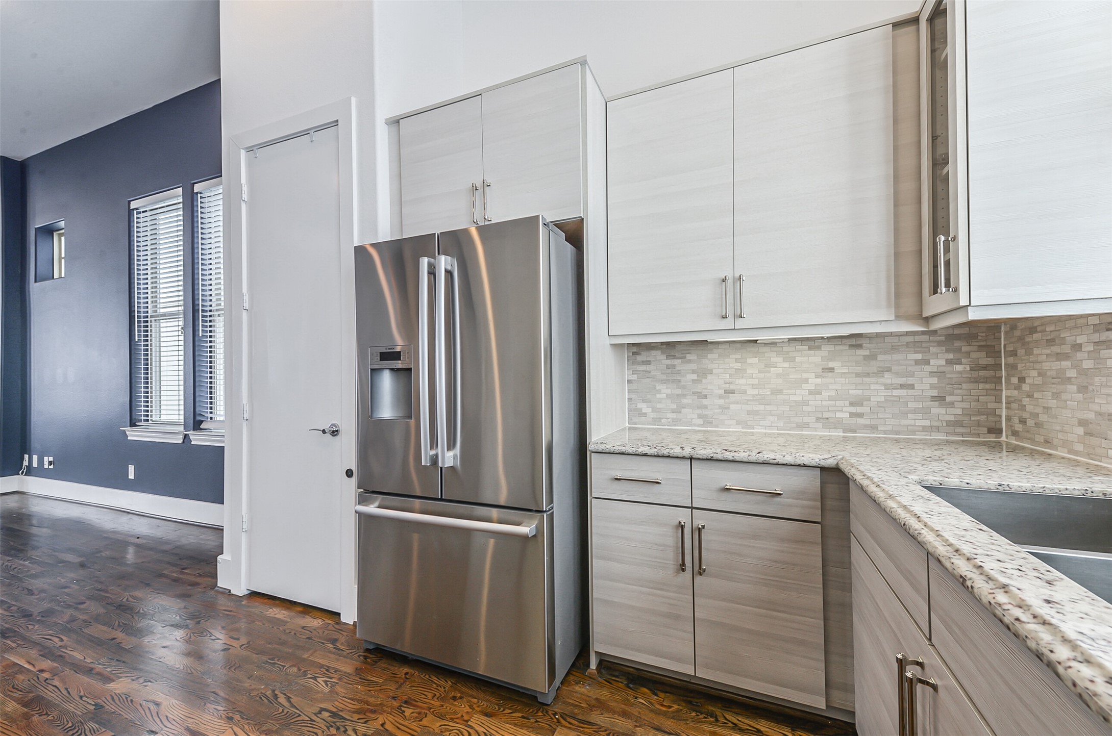 2715 Cohn Garden Lane Houston, TX 77007 - Photo 12 of 23 a kitchen with cabinets and stainless steel appliances