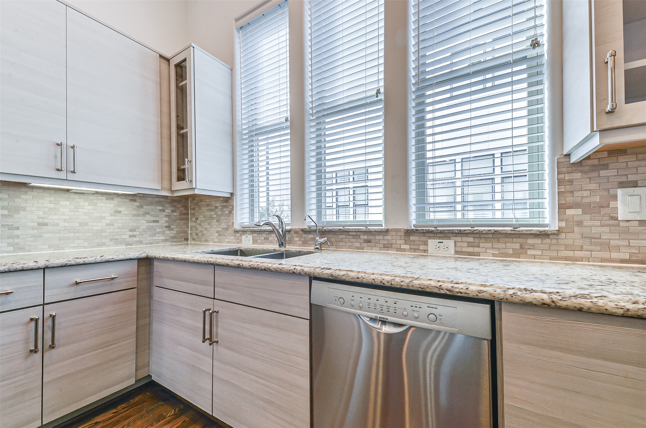 2715 Cohn Garden Lane Houston, TX 77007 - Photo 13 of 23 a kitchen with granite countertop cabinets and window