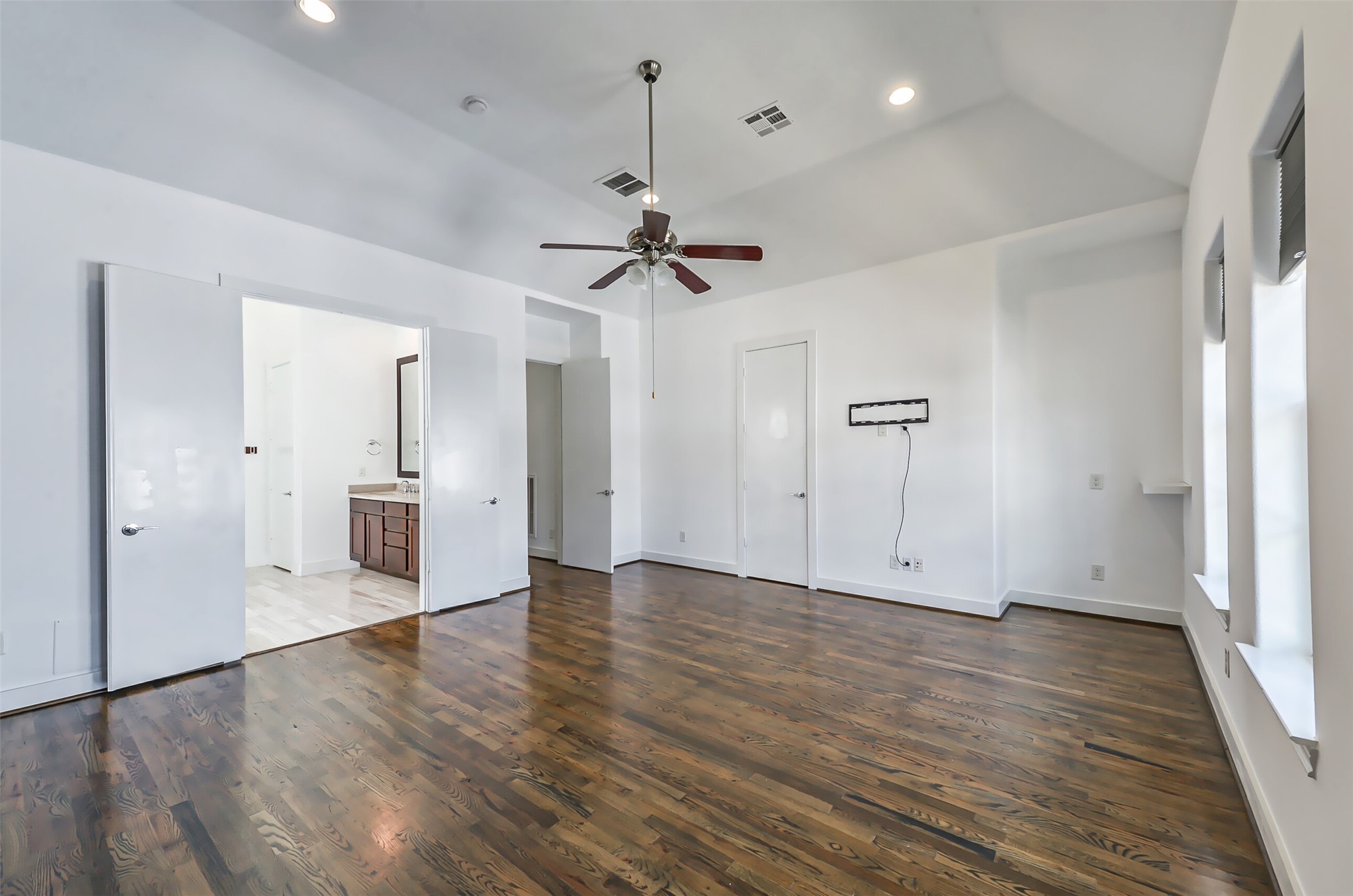 2715 Cohn Garden Lane Houston, TX 77007 - Photo 20 of 23 a view of an empty room with a ceiling fan window and a ceiling fan