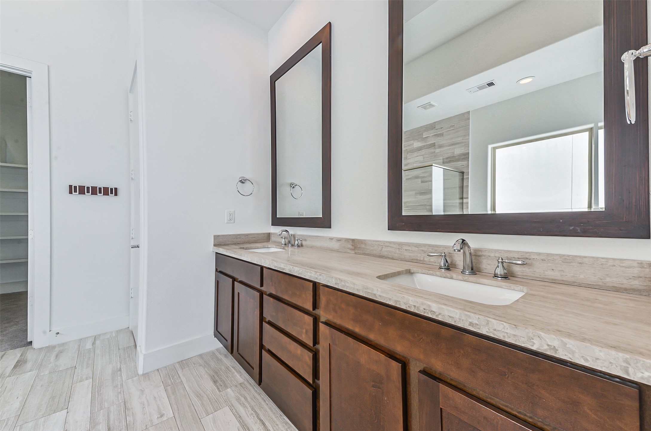 2715 Cohn Garden Lane Houston, TX 77007 - Photo 22 of 23 a bathroom with a double vanity sink and a mirror