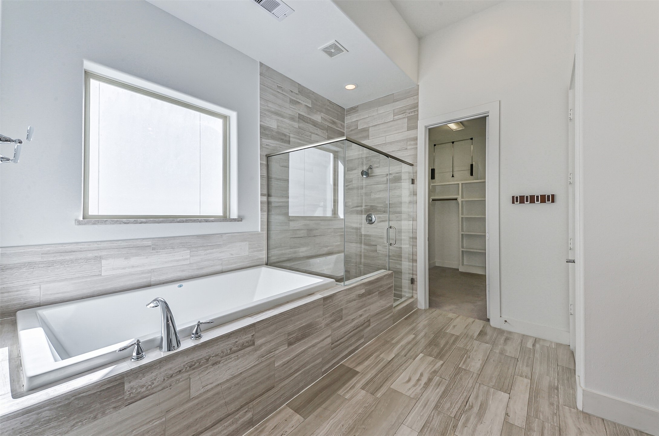 2715 Cohn Garden Lane Houston, TX 77007 - Photo 23 of 23 a bathroom with a tub shower and sink
