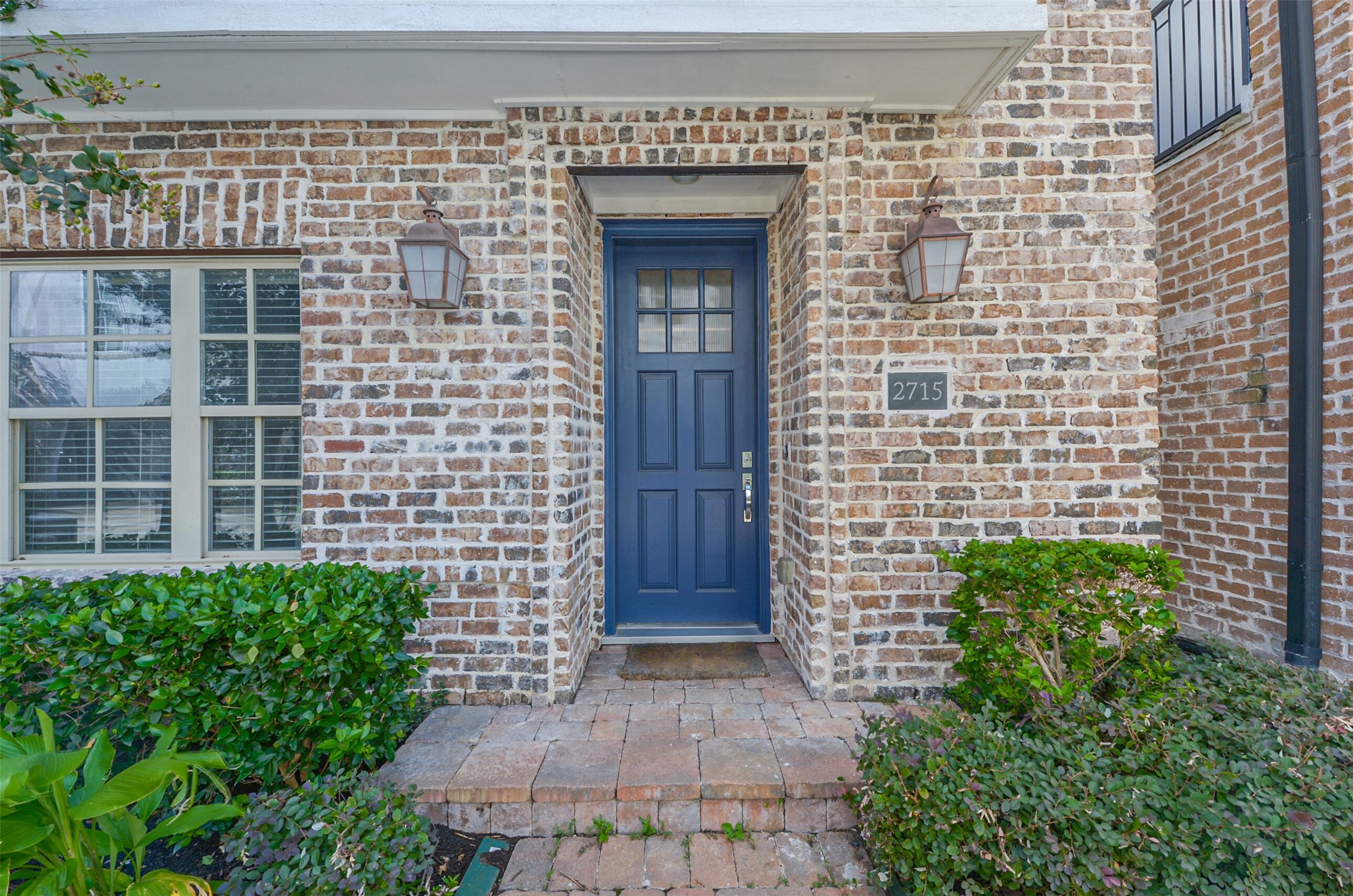2715 Cohn Garden Lane Houston, TX 77007 - Photo 4 of 23 a view of front door of a house with an window and potted plants