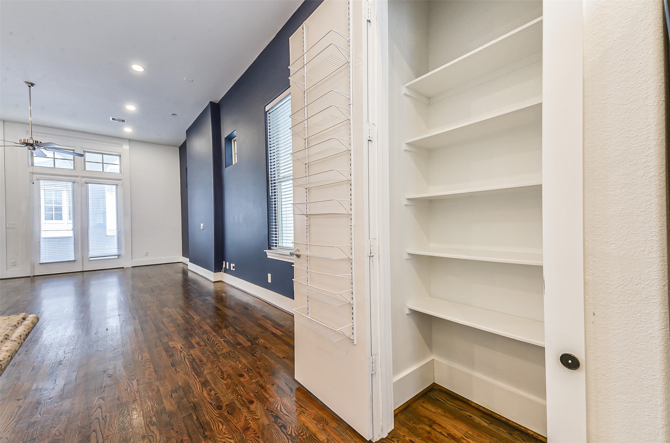 2715 Cohn Garden Lane Houston, TX 77007 - Photo 9 of 23 a view of an empty room with a window and wooden floor