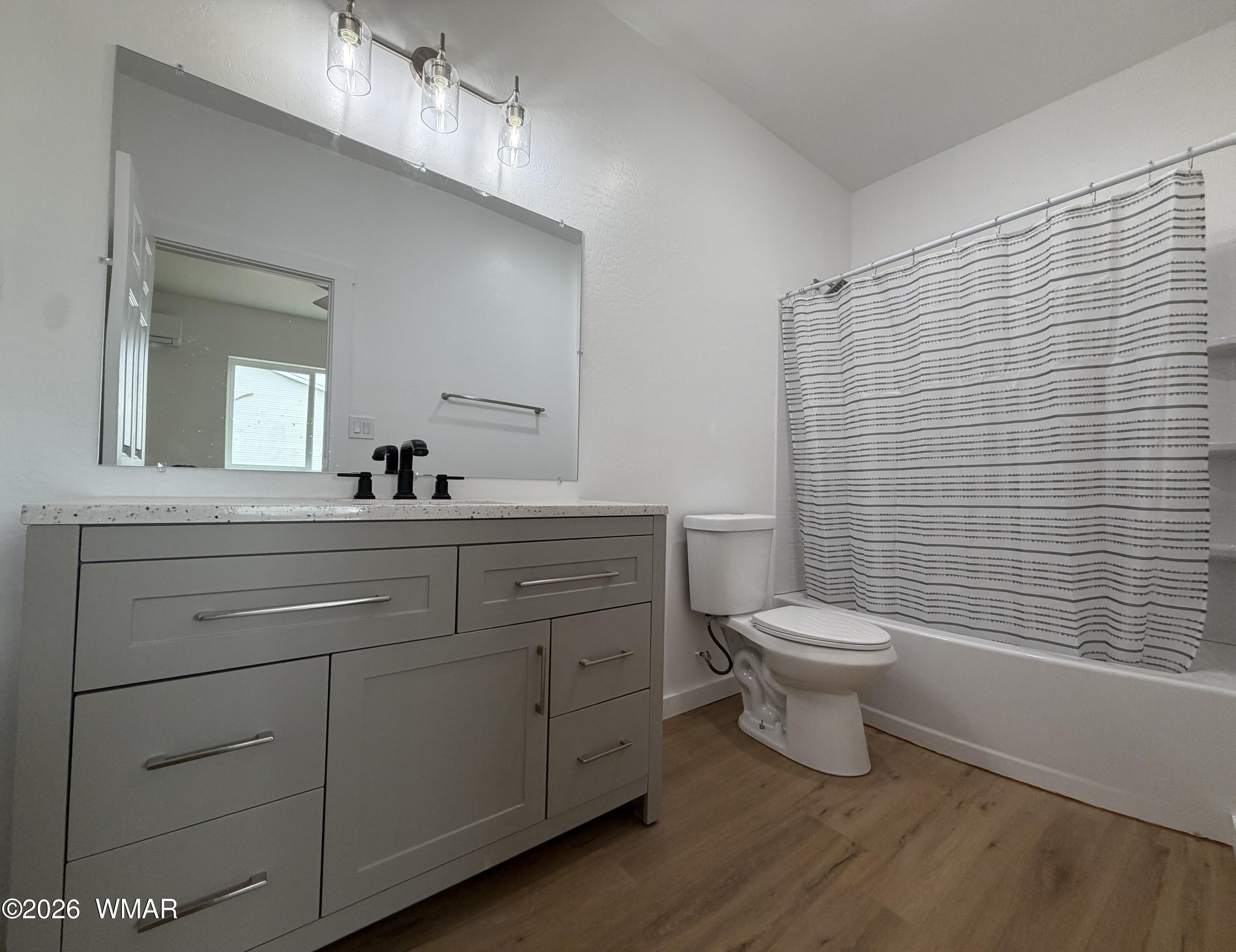 731 Tori Circle Springerville, AZ 85938 - Photo 12 of 19 a bathroom with a toilet a sink and mirror