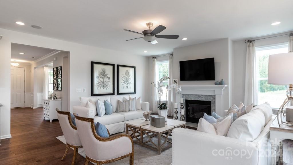 1237 Sugar Crk Road Indian Land, SC 29707 - Photo 11 of 25 a living room with furniture a fireplace and a flat screen tv