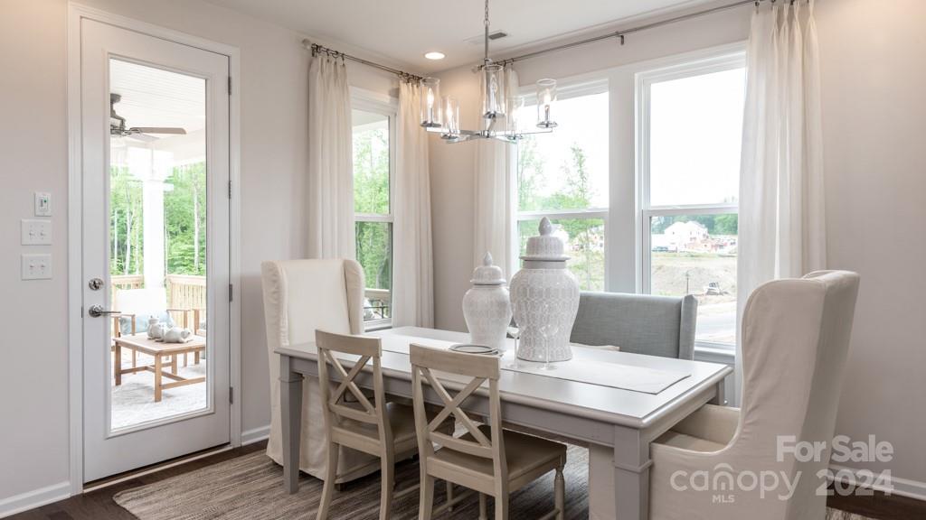 1237 Sugar Crk Road Indian Land, SC 29707 - Photo 7 of 25 a view of a dining room with furniture window and wooden floor