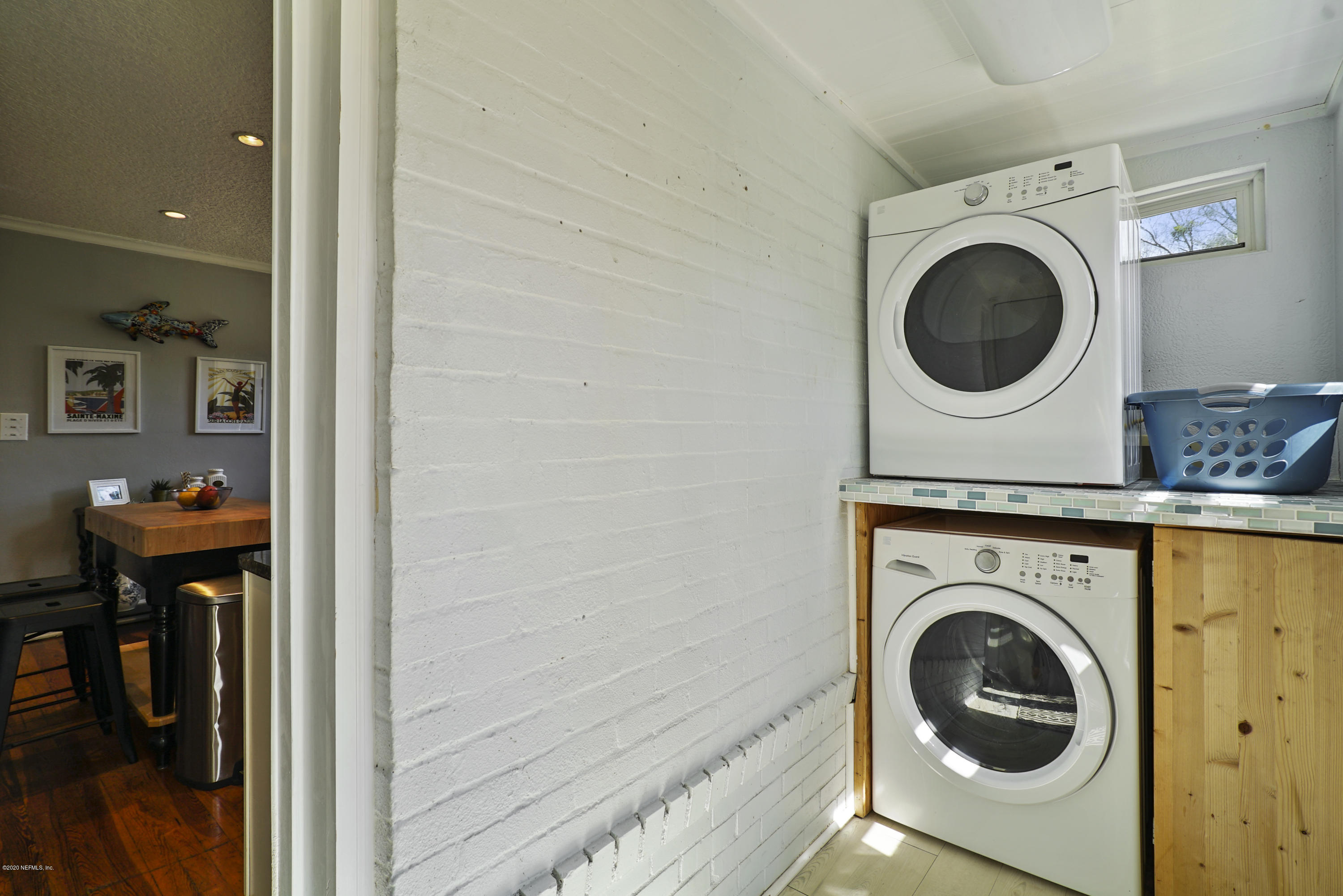 2212 Guilford Road Jacksonville, FL 32207 - Photo 16 of 20 a view of a storage & utility room with washer and dryer