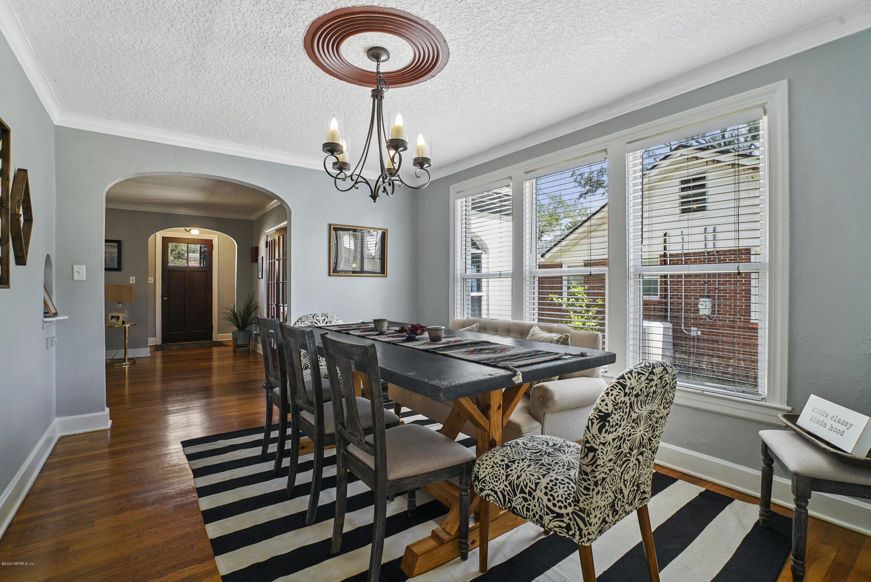 2212 Guilford Road Jacksonville, FL 32207 - Photo 8 of 20 a view of a dining room with furniture window and wooden floor