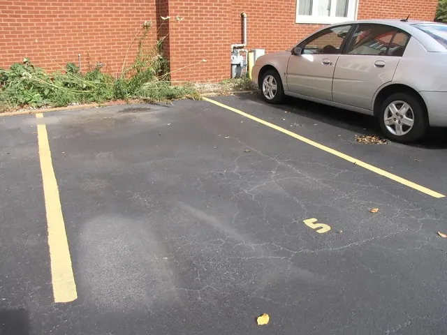 a view of a car in front of a house
