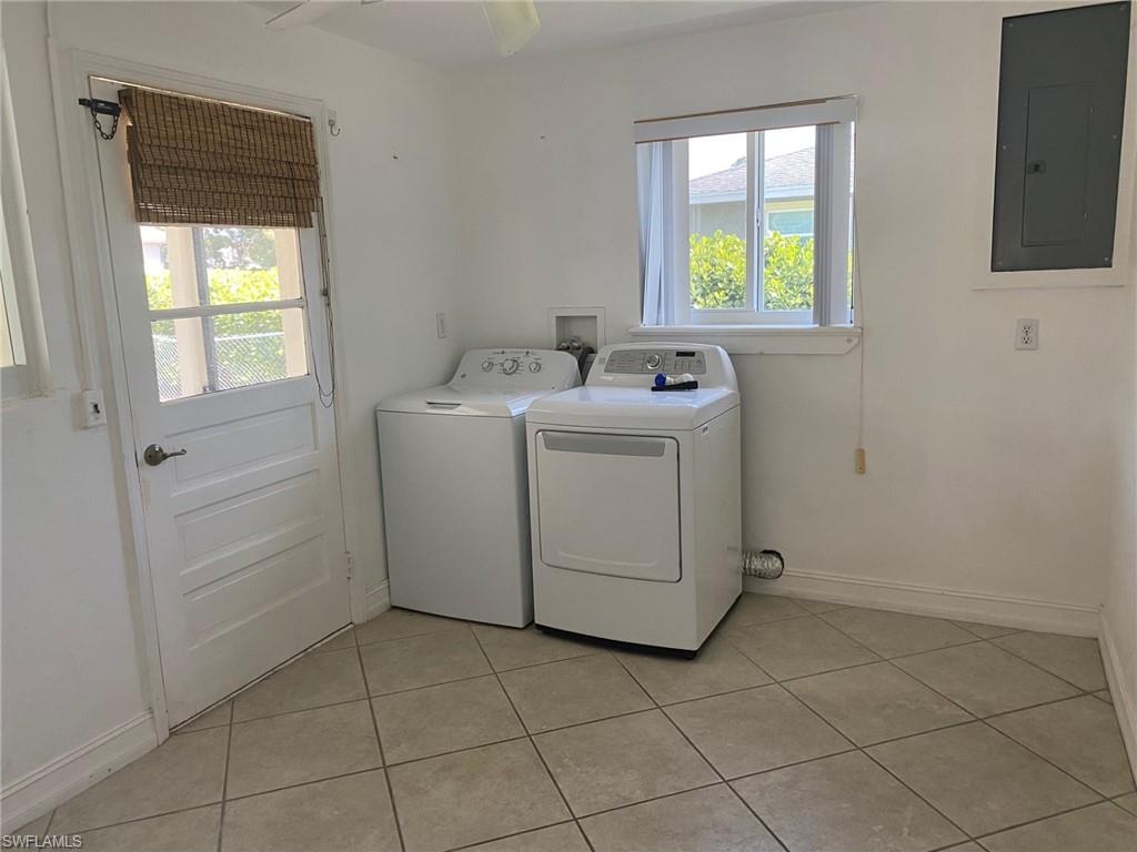 5241 Cypress Lane Naples, FL 34113 - Photo 12 of 15 a utility room with dryer and washer