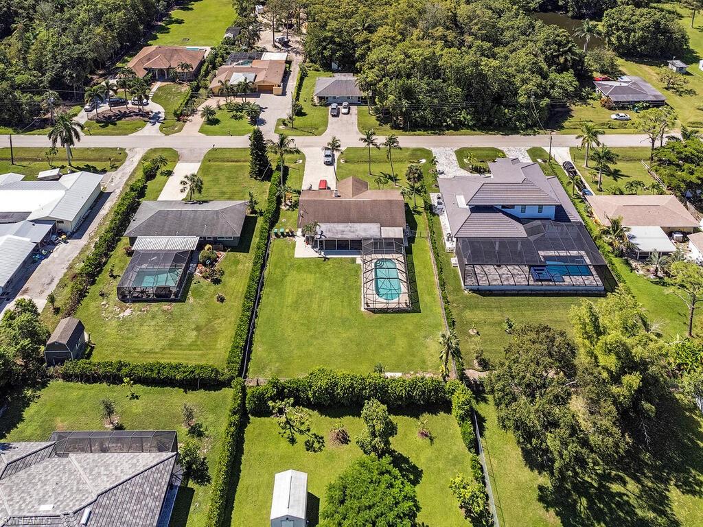 5241 Cypress Lane Naples, FL 34113 - Photo 14 of 15 an aerial view of residential houses with outdoor space