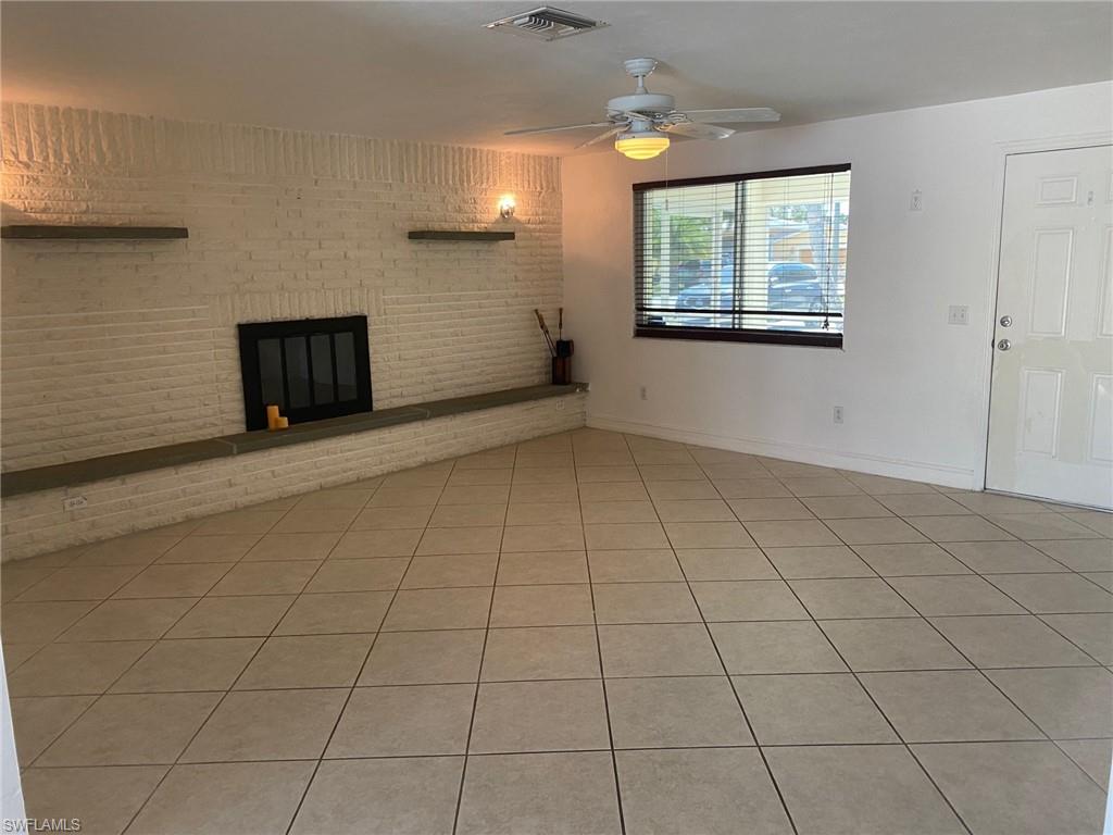 5241 Cypress Lane Naples, FL 34113 - Photo 2 of 15 a view of an empty room with a window