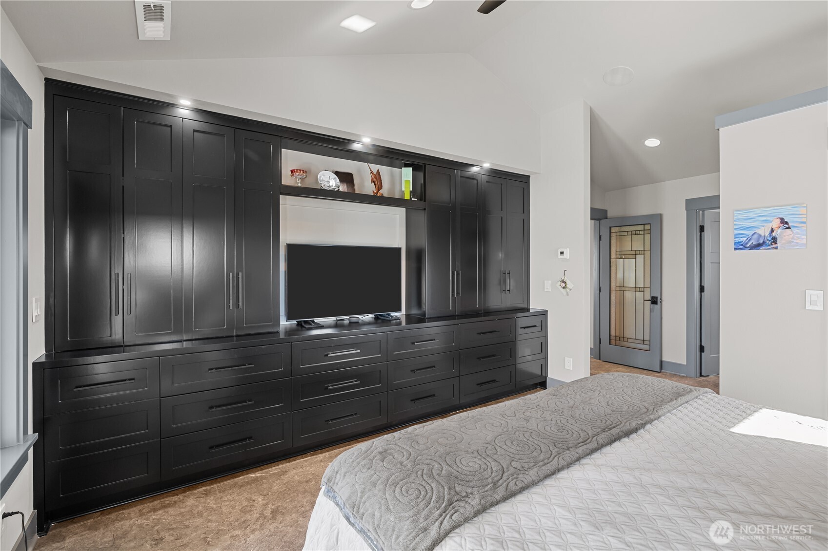 111 Wren Loop Southwest Mattawa, WA 99349 - Photo 15 of 40 a bedroom with a bed and a flat tv screen on dresser