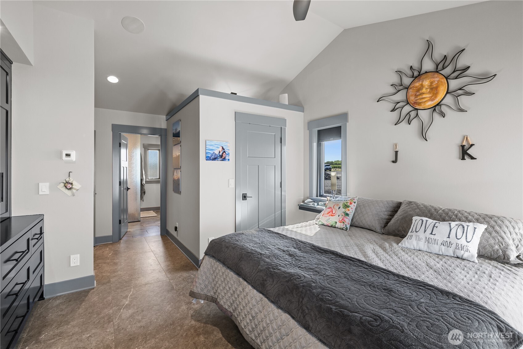 111 Wren Loop Southwest Mattawa, WA 99349 - Photo 16 of 40 a bedroom with a bed and a chandelier
