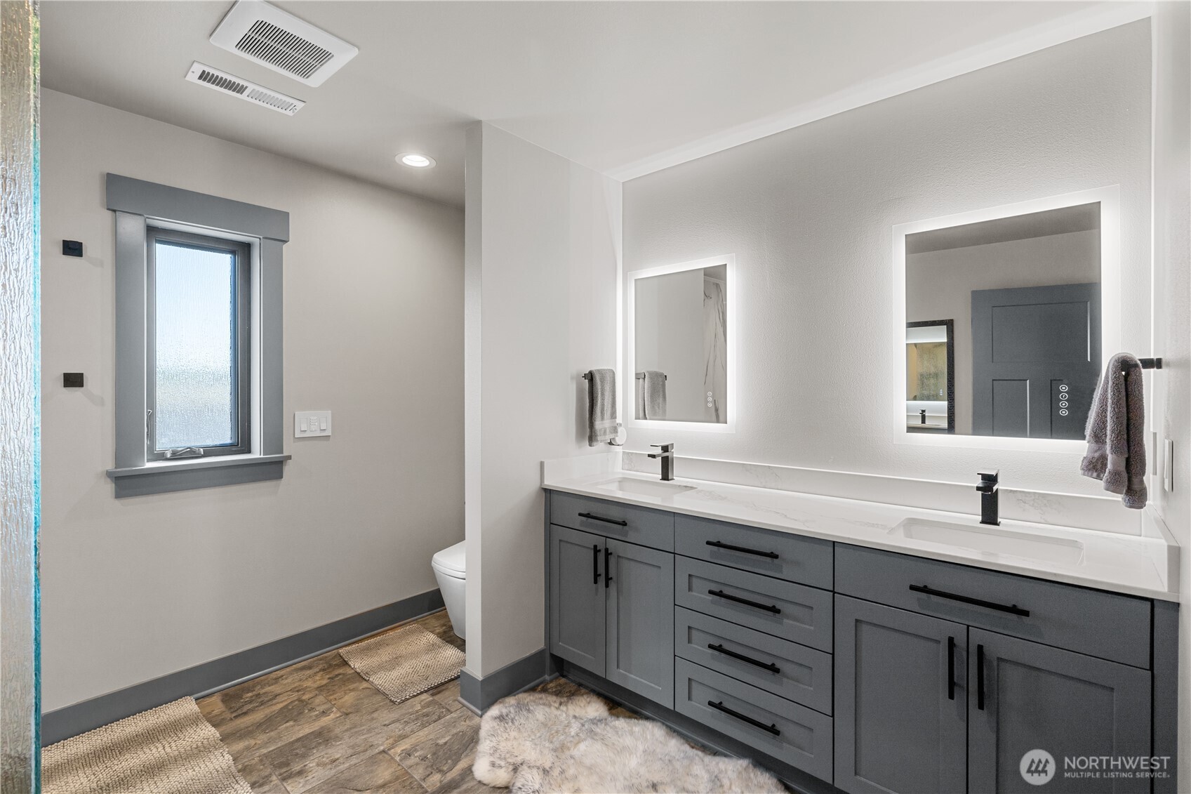 111 Wren Loop Southwest Mattawa, WA 99349 - Photo 17 of 40 a bathroom with a double vanity sink and a mirror