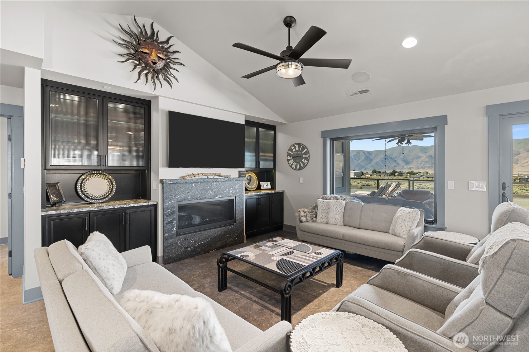 111 Wren Loop Southwest Mattawa, WA 99349 - Photo 7 of 40 a living room with furniture and a flat screen tv