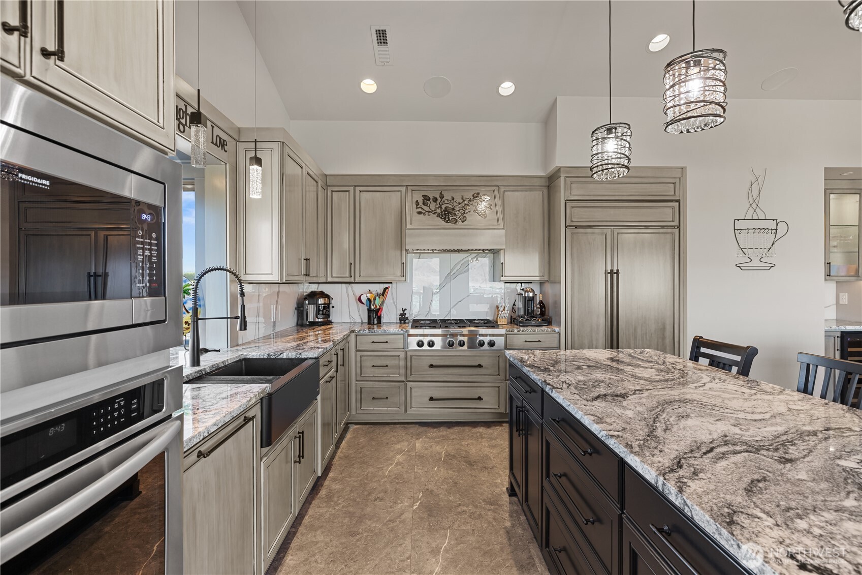 111 Wren Loop Southwest Mattawa, WA 99349 - Photo 10 of 40 a kitchen with stainless steel appliances granite countertop a sink stove and cabinets