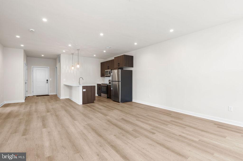 26 South York Road, Unit 210 Hatboro, PA 19040 - Photo 17 of 51 a view of a kitchen with a sink and a stove top oven