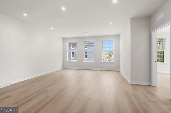 a view of a kitchen with a sink and a stove top oven