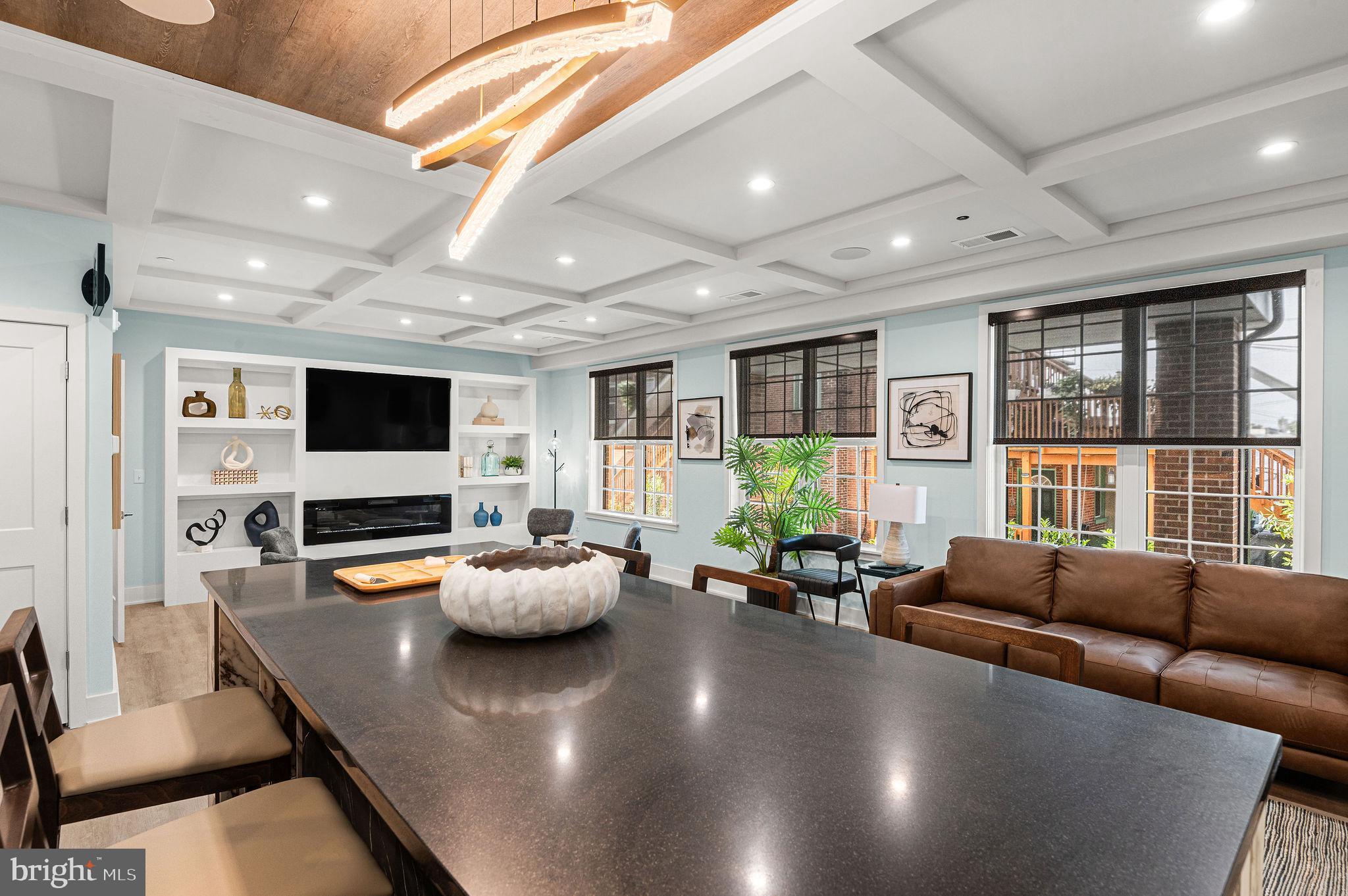26 South York Road, Unit 210 Hatboro, PA 19040 - Photo 43 of 52 a living room with furniture and a flat screen tv