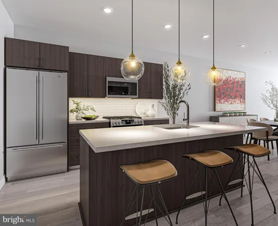 a kitchen with a table chairs and refrigerator
